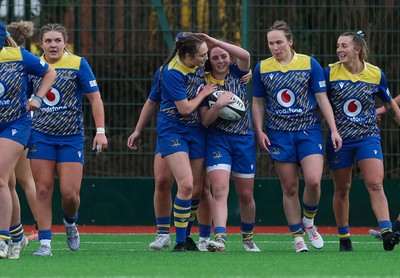 170126 - Gwalia Lightning v Edinburgh Rugby, Celtic Challenge - The team celebrate with Lily Hawkins of Gwalia Lightning after she scores try