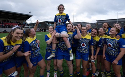 170126 - Gwalia Lightning v Edinburgh Rugby, Celtic Challenge - Lily Hawkins of Gwalia Lightning is held aloft by Jenny Hesketh of Gwalia Lightning and Maisie Davies of Gwalia Lightning at the end of the match