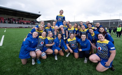 170126 - Gwalia Lightning v Edinburgh Rugby, Celtic Challenge - Lily Hawkins of Gwalia Lightning is held aloft during a team photograph at the end of the match