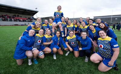 170126 - Gwalia Lightning v Edinburgh Rugby, Celtic Challenge - Lily Hawkins of Gwalia Lightning is held aloft during a team photograph at the end of the match