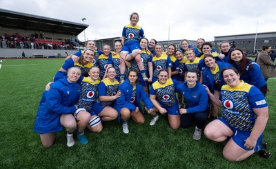 170126 - Gwalia Lightning v Edinburgh Rugby, Celtic Challenge - Lily Hawkins of Gwalia Lightning is held aloft during a team photograph at the end of the match