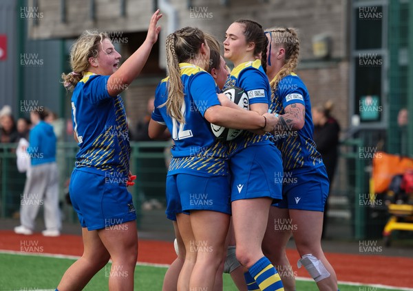 170126 - Gwalia Lightning v Edinburgh Rugby, Celtic Challenge - Caitlin Lewis of Gwalia Lightning celebrates with team mates after she dives in to score try