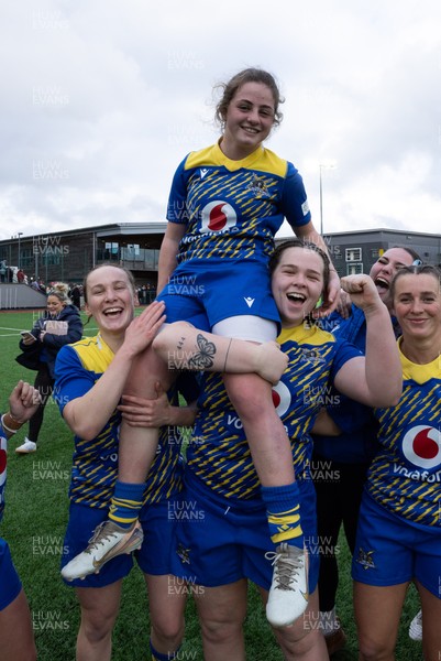 170126 - Gwalia Lightning v Edinburgh Rugby, Celtic Challenge - Lily Hawkins of Gwalia Lightning is held aloft by Jenny Hesketh of Gwalia Lightning and Maisie Davies of Gwalia Lightning at the end of the match