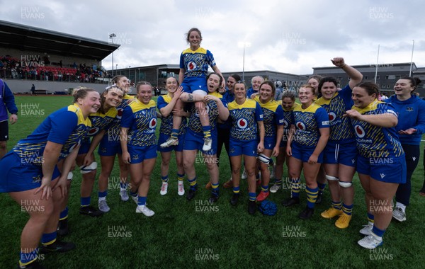 170126 - Gwalia Lightning v Edinburgh Rugby, Celtic Challenge - Lily Hawkins of Gwalia Lightning is held aloft by Jenny Hesketh of Gwalia Lightning and Maisie Davies of Gwalia Lightning at the end of the match