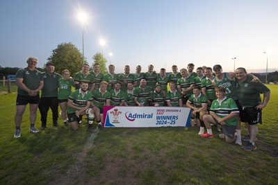 300425 - Gwernyfed RFC League Trophy Presentation - Admiral National League 4 West B - Gwernyfed RFC Captain Sam Stevens celebrates lifting the trophy with his team