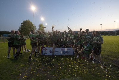 300425 - Gwernyfed RFC League Trophy Presentation - Admiral National League 4 West B - Gwernyfed RFC Captain Sam Stevens celebrates lifting the trophy with his team