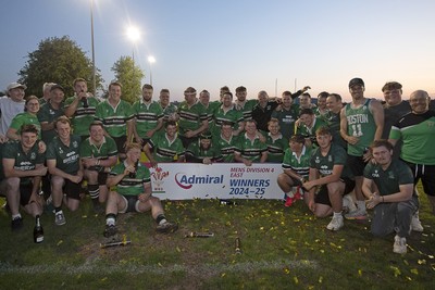 300425 - Gwernyfed RFC League Trophy Presentation - Admiral National League 4 West B - Gwernyfed RFC Captain Sam Stevens celebrates lifting the trophy with his team