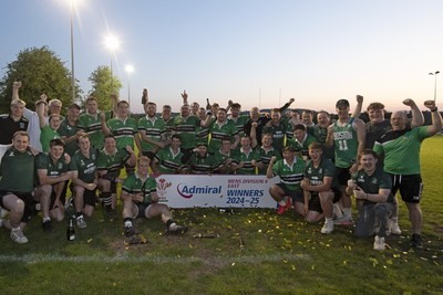 300425 - Gwernyfed RFC League Trophy Presentation - Admiral National League 4 West B - Gwernyfed RFC Captain Sam Stevens celebrates lifting the trophy with his team