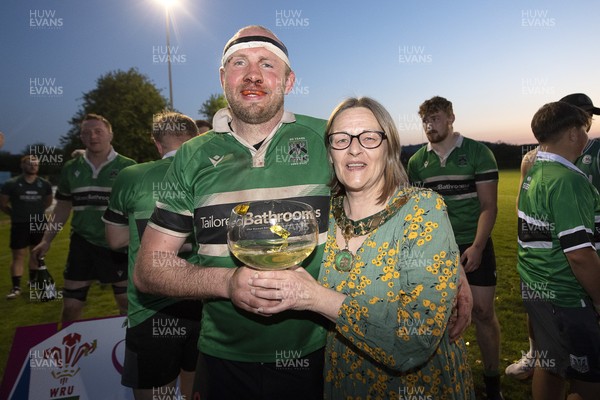 300425 - Gwernyfed RFC League Trophy Presentation - Admiral National League 4 West B - Gwernyfed RFC Captain Sam Stevens celebrates lifting the trophy with his team