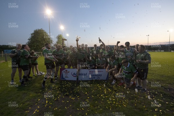 300425 - Gwernyfed RFC League Trophy Presentation - Admiral National League 4 West B - Gwernyfed RFC Captain Sam Stevens celebrates lifting the trophy with his team
