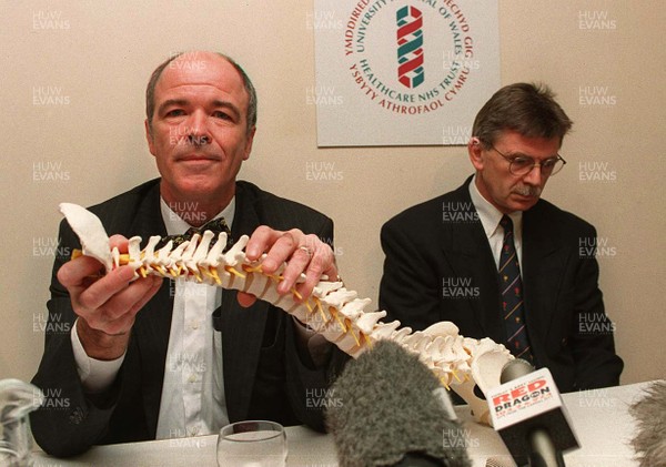 191297 - Gwyn Jones Injury Press Conference - Consultant neurosurgeon Jonathan Vafidis explains the injury by Gwyn's father Dr Alun Jones (right)