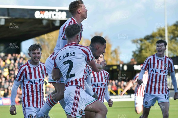 251025 - Harrogate Town v Newport County - Sky Bet League 2 - Courtney Baker-Richardson of Newport County (c) celebrates scoring their first goal with team mates