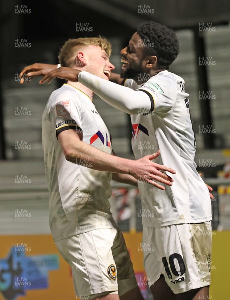 270224 - Harrogate Town v Newport County - Sky Bet League 2 - Offrande Zanzala of Newport County celebrates scoring the 3rd goal with Will Evans of Newport County