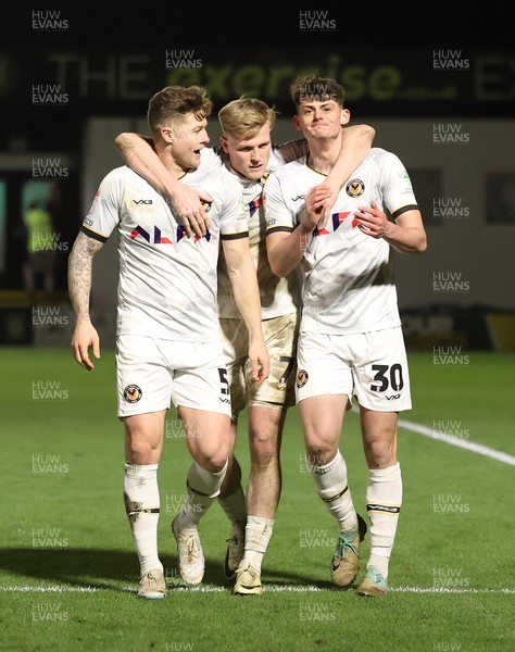 270224 - Harrogate Town v Newport County - Sky Bet League 2 - Seb Palmer-Houlden of Newport County celebrates scoring the 4th goal with Will Evans of Newport County and James Clarke of Newport County