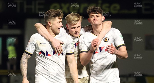 270224 - Harrogate Town v Newport County - Sky Bet League 2 - Seb Palmer-Houlden of Newport County celebrates scoring the 4th goal with Will Evans of Newport County and James Clarke of Newport County