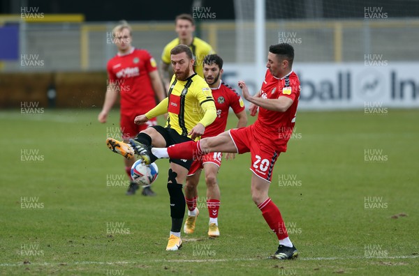 300121 - Harrogate Town v Newport County - Sky Bet League 2 - George Thomson of Harrogate Town and Anthony Hartigan of Newport County