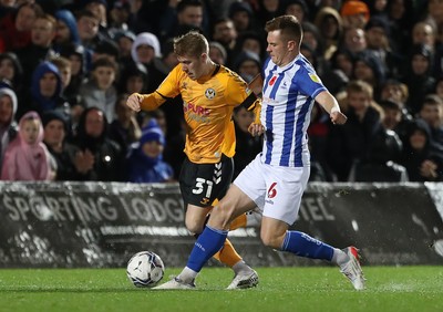 121121 - Hartlepool United v Newport County - EFL SkyBet League 2 - Newport County's Ollie Cooper battles for possession with Hartlepool United's Mark Shelton