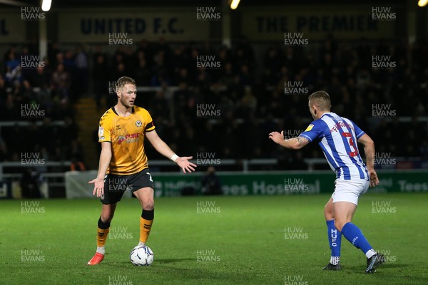 121121 - Hartlepool United v Newport County - EFL SkyBet League 2 - Cameron Norman of Newport County in action with Hartlepool United's David Ferguson