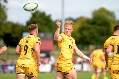 060925 - Hartpury College v Dragons RFC - Preseason Friendly - David Richards of Dragons celebrates scoring a try