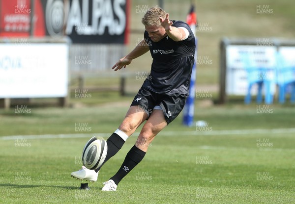 040921 - Hartpury University RFC v Ospreys, Pre-season Friendly - Gareth Anscombe of Ospreys warms up with the match day squad, but does not take part in the match