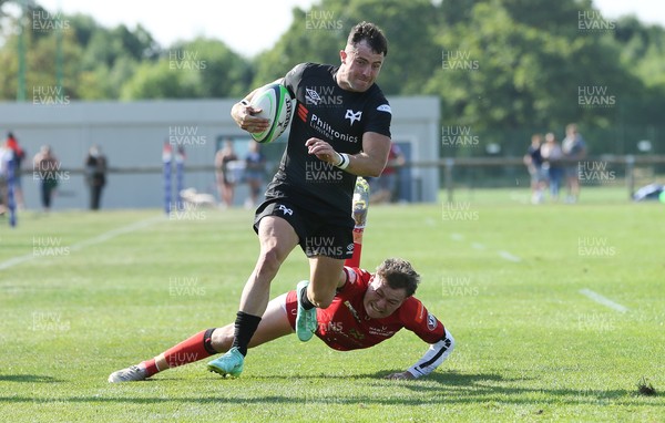040921 - Hartpury University RFC v Ospreys, Pre-season Friendly - Luke Morgan of Ospreys is challenged as he charges for the line