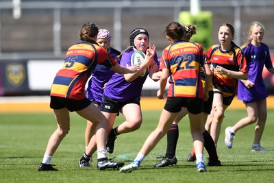 060525 - Haverfordwest High v Ysgol Godrer Berwyn - Girls Schools U12s Cup Final - Isla Chesmer of Haverfordwest is challenged by Cadi Evans of Ysgol Godrer Berwyn