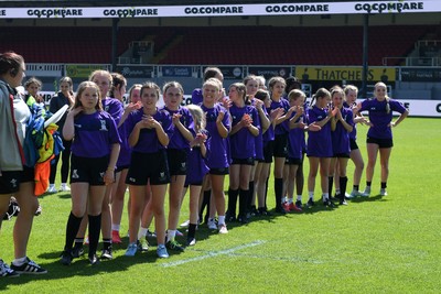 060525 - Haverfordwest High v Ysgol Godrer Berwyn - Girls Schools U12s Cup Final - Haverfordwest players waiting for the trophy