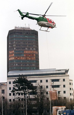 010499 - Helicopter Lift, Cardiff - One of the ventilation units is lifted from Cathays Park to the top of the Capital Tower 