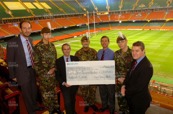 28.11.08 -  Help for Heroes cheque presentation at the Millennium Stadium   WRU Chairman David Pickering (right)  and Chief Executive Roger Lewis (3rd from right) hand over  a cheque for 