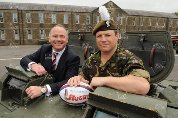 15.07.08 - Help for Heroes Rugby Challenge Match Press Conference - Ieuan Evans(International Select XV Manager) and Scott Gibbs(International Select XV Captain) sit in a Royal Welsh Armored Personnel Carrier during the Welsh launch of the Help for Heroes rugby challenge match at Maindy Barracks, Cardiff. 