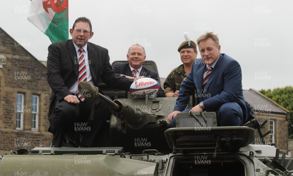 15.07.08 - Help for Heroes Rugby Challenge Match Press Conference - (L-R)Phil Davies(International Select XV Assistant Coach), Ieuan Evans(International Select XV Manager), Scott Gibbs(International Select XV Captain) and Eddie O'Sullivan sit in a Royal Welsh Armored Personnel Carrier during the Welsh launch of the Help for Heroes rugby challenge match at Maindy Barracks, Cardiff. 