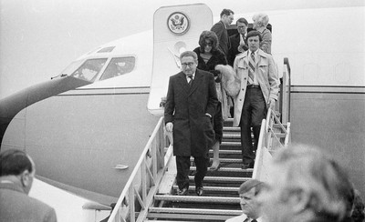 060375 - Dr Henry Kissinger visit to Cardiff for the ceremony to give Jim Callaghan the Freedom of the City  Dr Henry Kissinger steps down from the plane with his wife Nancy at Cardiff Wales Airport