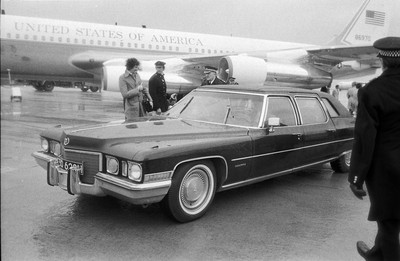 060375 - Dr Henry Kissinger visit to Cardiff for the ceremony to give Jim Callaghan the Freedom of the City  Dr Henry Kissinger having arrived by plane at Cardiff Wales Airport leaves in his car for Cardiff