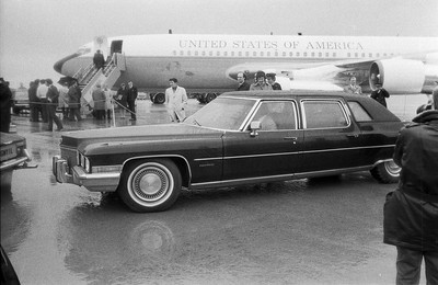 060375 - Dr Henry Kissinger visit to Cardiff for the ceremony to give Jim Callaghan the Freedom of the City  Dr Henry Kissinger having arrived by plane at Cardiff Wales Airport leaves in his car for Cardiff