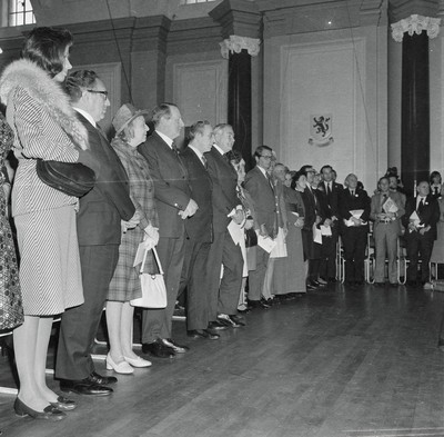 060375 - Dr Henry Kissinger visit to Cardiff for the ceremony to give Jim Callaghan the Freedom of the City  The US Secretary of State, Dr Henry Kissinger and his wife Nancy  watch the ceremony giving the Freedom of the City of Cardiff to Foreign Secretary Jim Callaghan Next to Dr Henry Kissinger are Sir Cenydd Treharne and Lady Treharne The ceremony was in Cardiff City Hall