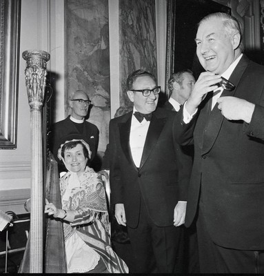 060375 - Dr Henry Kissinger visit to Cardiff for the ceremony to give Jim Callaghan the Freedom of the City  US Secretary of State Dr Henry Kissinger with Foreign Secretary Jim Callaghan watching a harpist at the banquet in Cardiff City Hall