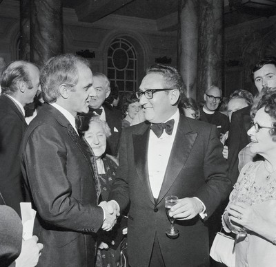 060375 - Dr Henry Kissinger visit to Cardiff for the ceremony to give Jim Callaghan the Freedom of the City  US Secretary of State Dr Henry Kissinger meets TV presenter Brian Hoey at the banquet in Cardiff City Hall