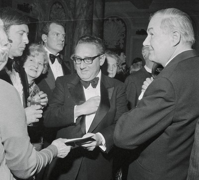 060375 - Dr Henry Kissinger visit to Cardiff for the ceremony to give Jim Callaghan the Freedom of the City  US Secretary of State Dr Henry Kissinger with Foreign Secretary Jim Callaghan meet guests at the banquet in Cardiff City Hall