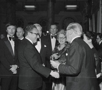 060375 - Dr Henry Kissinger visit to Cardiff for the ceremony to give Jim Callaghan the Freedom of the City  US Secretary of State Dr Henry Kissinger with Foreign Secretary Jim Callaghan meet guests at the banquet in Cardiff City Hall