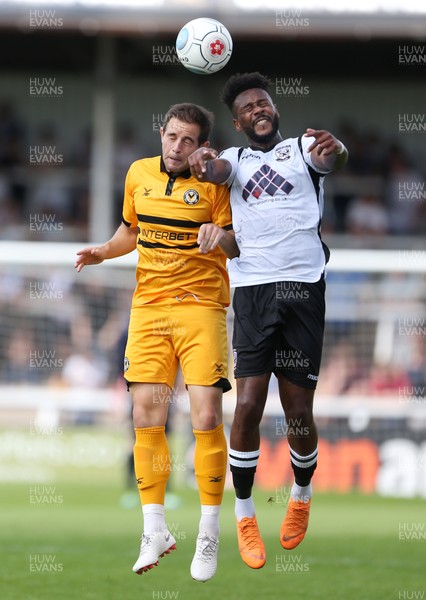 210718 - Hereford FC v Newport County - Pre Season Friendly - Matthew Dolan of Newport County goes up for the ball with Jennison Myrie-Williams of Hereford