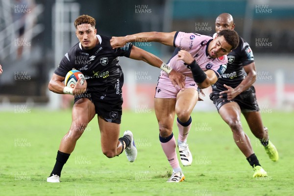 270326 - Hollywoodbets Sharks v Cardiff Rugby, United Rugby Championship - Jordan Hendrikse of the Hollywoodbets Sharks hands off Ben Thomas of Cardiff Rugby