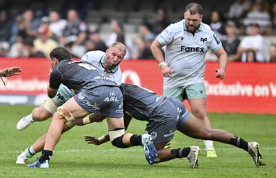 260926 - Hollywoodbets Sharks v Ospreys - United Rugby Championship - Ross Moriarty of Ospreys gets a double hit from Nick Hatton, Captain of The Sharks, and Manu Tshituka of The Sharks