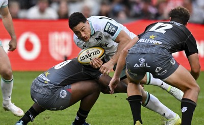 260926 - Hollywoodbets Sharks v Ospreys - United Rugby Championship - Owen Watkin of Ospreys is tackled by Vusi Moyo of The Sharks