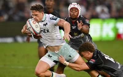 260926 - Hollywoodbets Sharks v Ospreys - United Rugby Championship - Kieran Hardy of Ospreys is tackled inches from the line by Luan Giliomee of The Sharks and Zekhethelo Siyaya of The Sharks