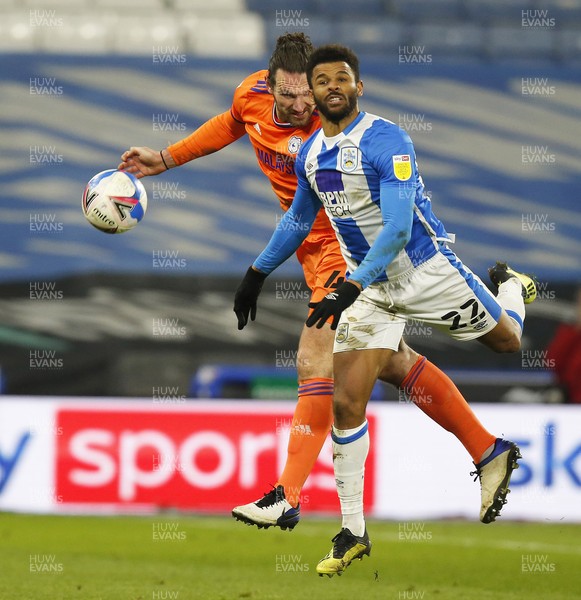 050321 - Huddersfield Town v Cardiff City - Sky Bet Championship - Sean Morrison of Cardiff and Joel Pereira of Huddersfield chase the ball
