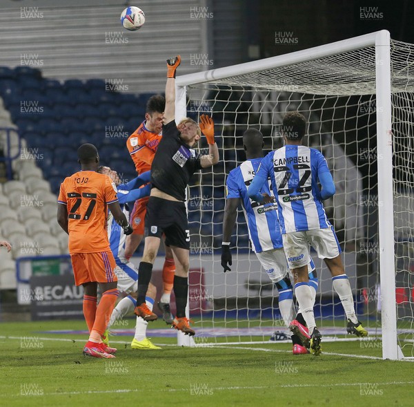 050321 - Huddersfield Town v Cardiff City - Sky Bet Championship - Goalkeeper Ryan Scholfield of Huddersfield and Kieffer Moore of Cardiff in the goal mouth reach for the corner cross penalty? IN THE 2ND HALF