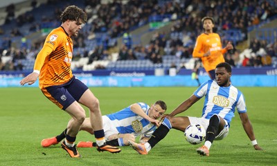 140426 - Huddersfield Town v Cardiff City - Sky Bet League 1 - Ollie Tanner of Cardiff and Bali Mumba of Huddersfield and Murray Wallace of Huddersfield