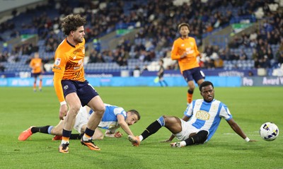140426 - Huddersfield Town v Cardiff City - Sky Bet League 1 - Ollie Tanner of Cardiff Shoots for goal past Bali Mumba of Huddersfield and Murray Wallace of Huddersfield
