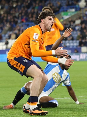 140426 - Huddersfield Town v Cardiff City - Sky Bet League 1 - Ollie Tanner of Cardiff Shoots for goal past Bali Mumba of Huddersfield and Murray Wallace of Huddersfield but sees it past the goal