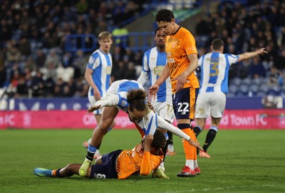 140426 - Huddersfield Town v Cardiff City - Sky Bet League 1 - Omari Kellyman of Cardiff and Marcus Harness of Huddersfield tussle